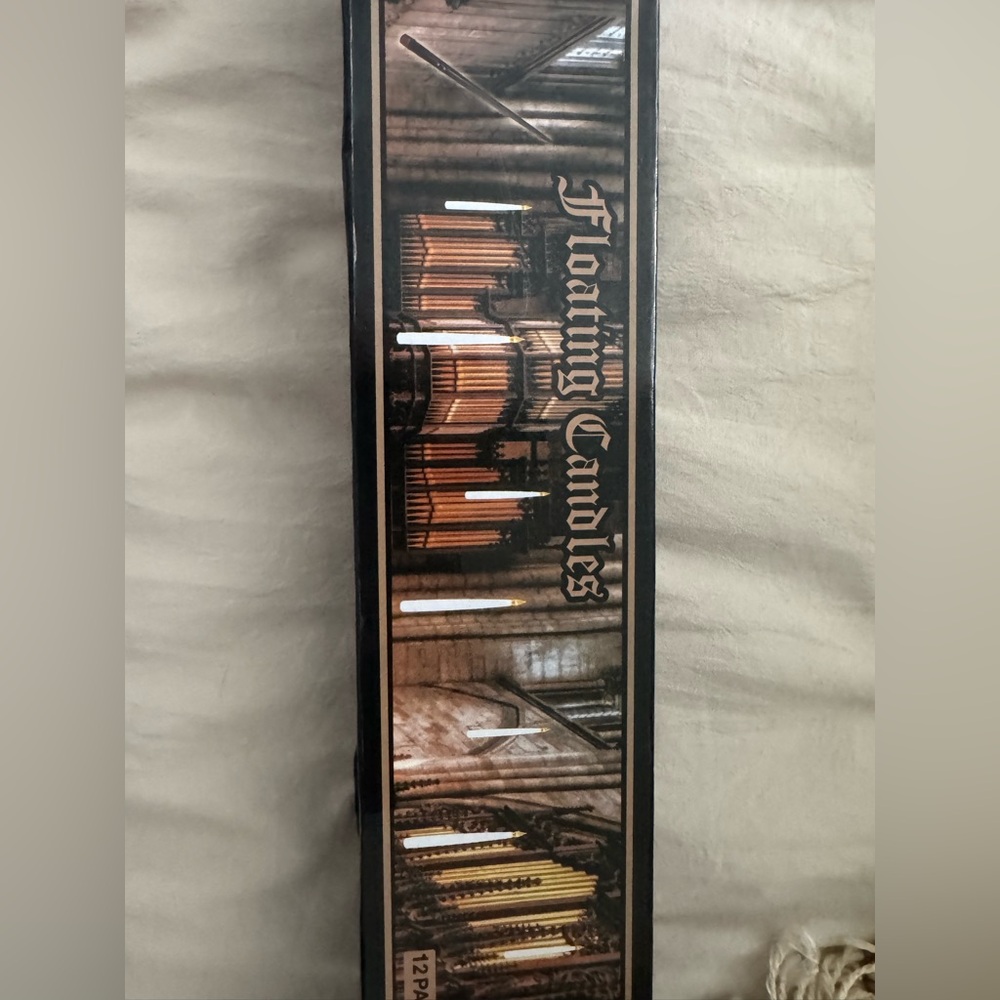 New in box 12pc set of floating candles